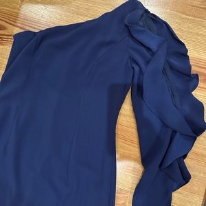 A- line one shoulder dress by Carmen Marc Valvo.  Navy blue. Ruffle sleeve